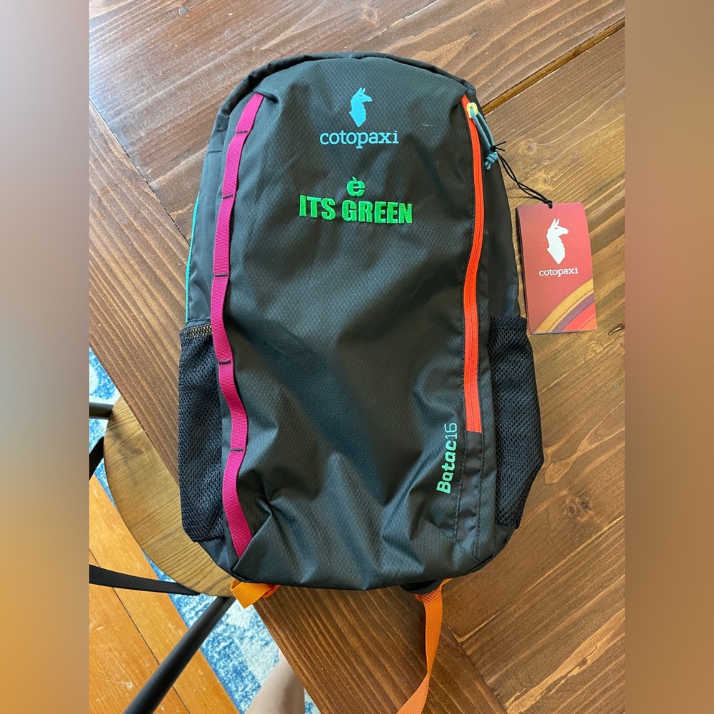 Cotopaxi Black and Orange Backpack with Sporty Design